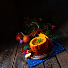 Delicious autumn pumpkin soup with baguette