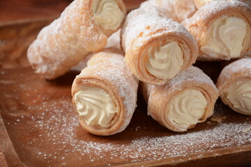 Elegant french cream horn pastries. Delicious cream horns filled with vanilla cream