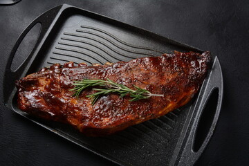 Closeup of pork ribs grilled with BBQ sauce and caramelized in honey