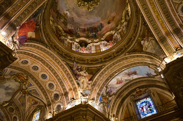 Obraz premium Cordoba, Argentina - January, 2020: Interior of Cathedral of Cordoba church ( Iglesia de Nuestra Senora de la Asuncion) . Painted ceiling fresco view of religions saints in Christianity.