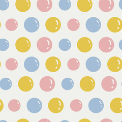 Seamless pattern with cartoon balls in yellow, blue and pink. Bright vector illustration. Great for designing children's pyjamas, clothing, bedding, scrapbooking, patchwork, children's school supplies