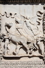 Basrelief with angels and horse in Rome, Italy