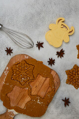 preparation of holiday cookies for Christmas, uncooked cookies in the form of a 2021 new year's symbol snowflake from raw dough