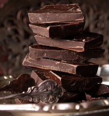 Pieces of dark chocolate stacked on top of each other