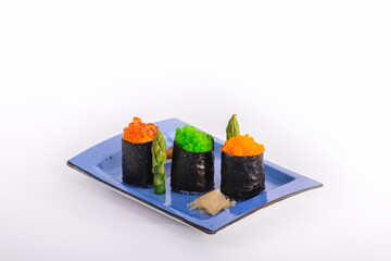 view of beautiful maki pieces with pickled ginger and asparagus on a small tray