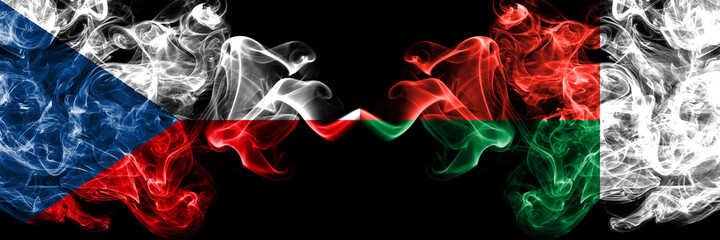Czech Republic, Czech vs Madagascar smoky mystic flags placed side by side. Thick colored silky abstract smoke flags.