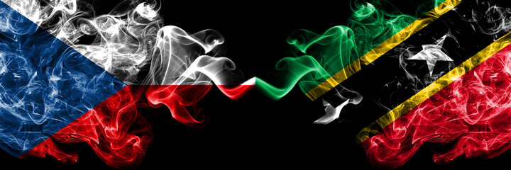 Czech Republic, Czech vs Saint Kitts and Nevis smoky mystic flags placed side by side. Thick colored silky abstract smoke flags.