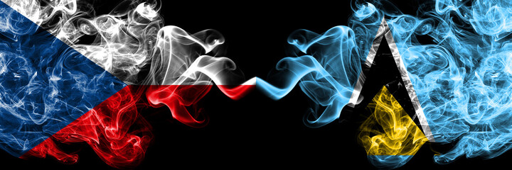 Czech Republic, Czech vs Saint Lucia smoky mystic flags placed side by side. Thick colored silky abstract smoke flags.