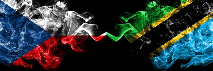 Czech Republic, Czech vs Tanzania smoky mystic flags placed side by side. Thick colored silky abstract smoke flags.