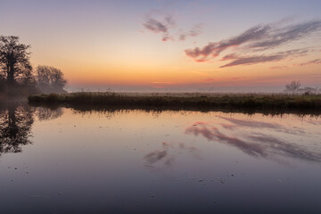 Colorful sunrise in Dutch polder landscape