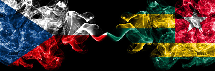Czech Republic, Czech vs Togo smoky mystic flags placed side by side. Thick colored silky abstract smoke flags.