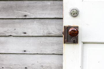 Vintage door with new deadbolt lock for security.