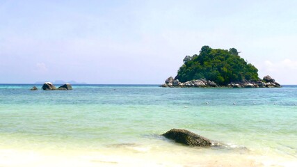 Beautiful paradise beach with white sand, turquoise water and rocks at Koh Lipe, Satun, Thailand.