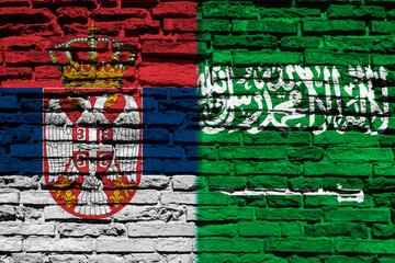 Flag of Serbia and Saudi Arabia on the brick wall