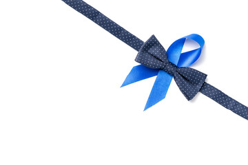 Men cancer. Blue ribbon, fashion bowtie isolated on white background. Awareness prostate cancer of...