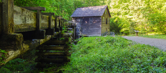 Fototapeta na wymiar Historic Grist Mill Panorama. Exterior of historic Mingus Mill in the Great Smoky Mountains National Park. This is a historic structure within a national park and not private property. 