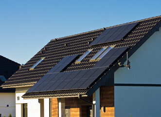Modern solar panels on the roof of private house