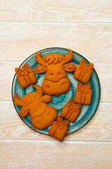 cooking a delicious festive homemade cookies a symbol of  new year a cow or bull, a treat for christmas holiday, xmas theme