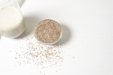 steeped in a glass of white Chia seeds on a light background, dry Chia in a glass plate, vegetarian healthy food with omega and vitamins. superfood for weight loss and self-care
