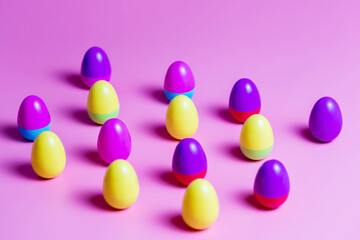 Colorful Plastic Easter Eggs on pink background