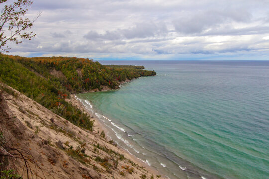 Steep Cliff On Coast. Massive sand dune forms a large cliff on the coast of Lake Superior at the popular Log Slide Overlook along the Pictured Rocks National Lakeshore in Michigan.