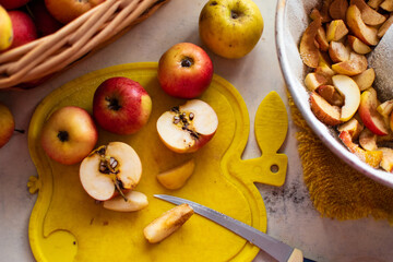 Tasty apple pie preparation in progress; process or recipe for cooking with ingredients and kitchen utensils
