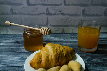 Still life with fresh fruits and glass of juice on the wooden background