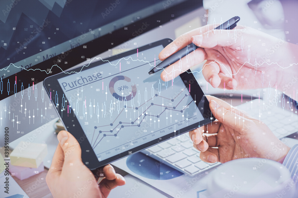 Poster double exposure of man's hands holding and using a phone and financial chart drawing. market analysi