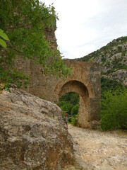 Fototapeta na wymiar old stone gate in the mountains
