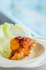 main course of Deep fried Oyster in Lettuce Cup served in a white china porcelain bowl