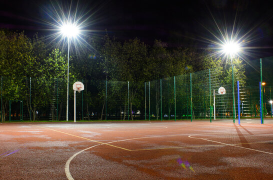 Empty Basketball Court In The Night Park