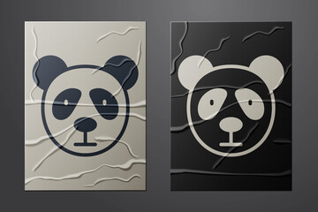 White Cute panda face icon isolated on crumpled paper background. Animal symbol. Paper art style. Vector. © Vadim
