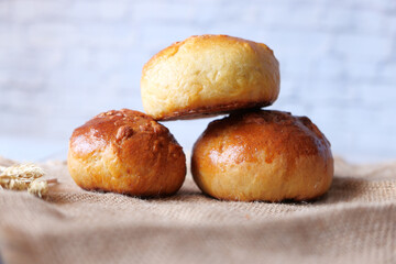 close up of stack of baked bread on table 