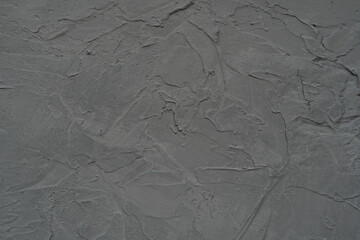 Gray rough untreated wall, background. Paint strokes