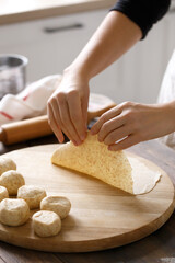 Female hands in the process of cooking homemade flatbreads - 395925757