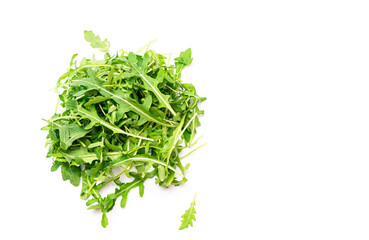 Vegetarian food, natural vitamins in green arugula leaf on white background