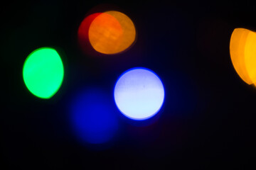 Abstract bokeh background wallpaper. colorful lights on a black background