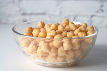 chick peas in a bowl on white background 