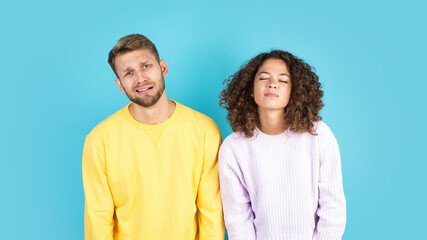 Mixed race friends standing on blue background