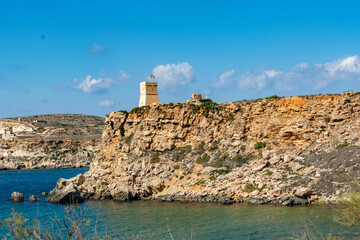 Fototapeta na wymiar Ghajn Tuffieha Tower overlooking the sea at Mgarr, Malta.