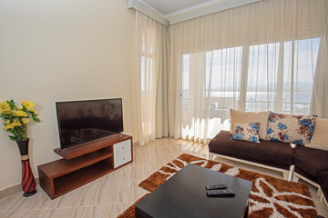 Interior design of luxury apartment living room with balcony