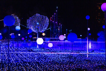 Illuminations light up at Tokyo, Japan. The illuminations in the theme of earth, space, galaxy for Christmas Eve LED light technology..Illuminations light up at at Tokyo Midtown, Roppongi Hills