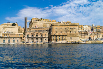 The Lascaris Battery also known as Fort Lascaris overlooking the Grand Harbour. The Upper Barrakka Gardens and Saluting Battery are above the fort, Valletta, Malta.