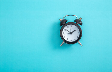 Alarm clock on a color background.