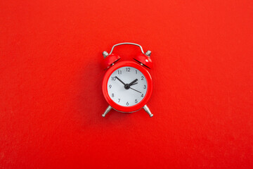 Alarm clock on a color background.