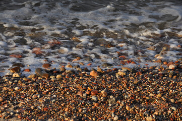 Rocks, water and foam close-up