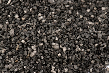 black food salt in crystals, scattered on the table