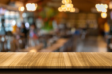 A wooden table on a restaurant blurred background