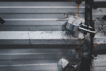Closeup of the old key with a key on the zinc door