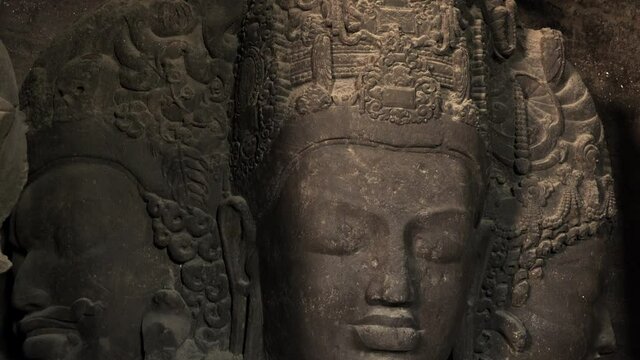 The ancient 6-metre (20 ft) high Trimurti sculpture at Elephanta Caves, a collection of cave temples predominantly dedicated to the Hindu god Shiva on Elephanta Island in Mumbai, Maharashtra, India.